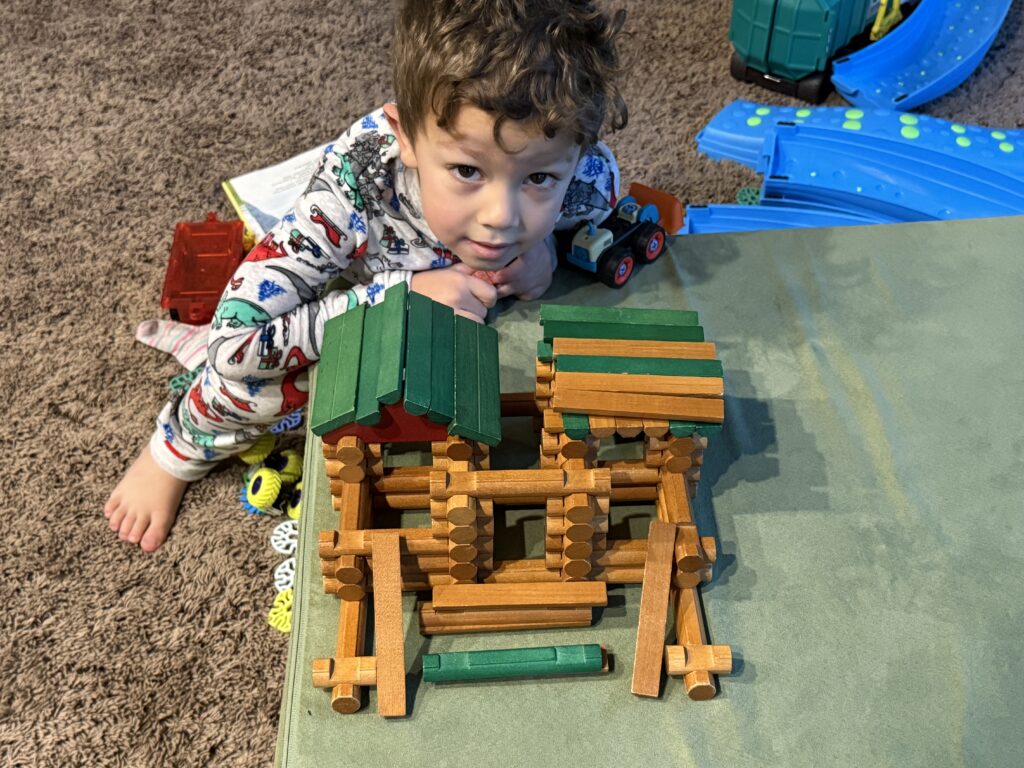 Log Cabin Insurance: My son Lincoln, building with Lincoln Logs